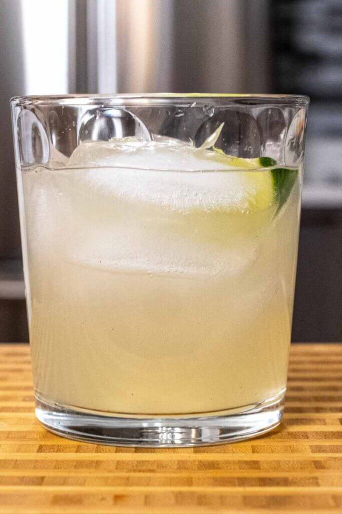 side shot of a rum moscow mule in a low ball glass with lime wedge