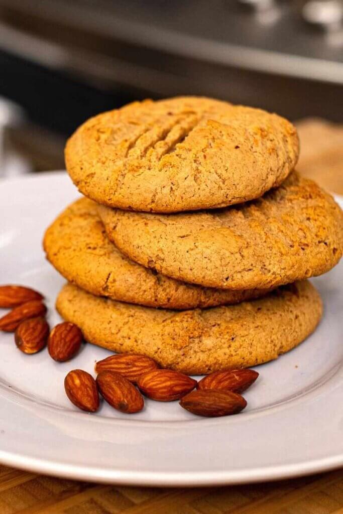side view of miso almond butter cookies on a white plate