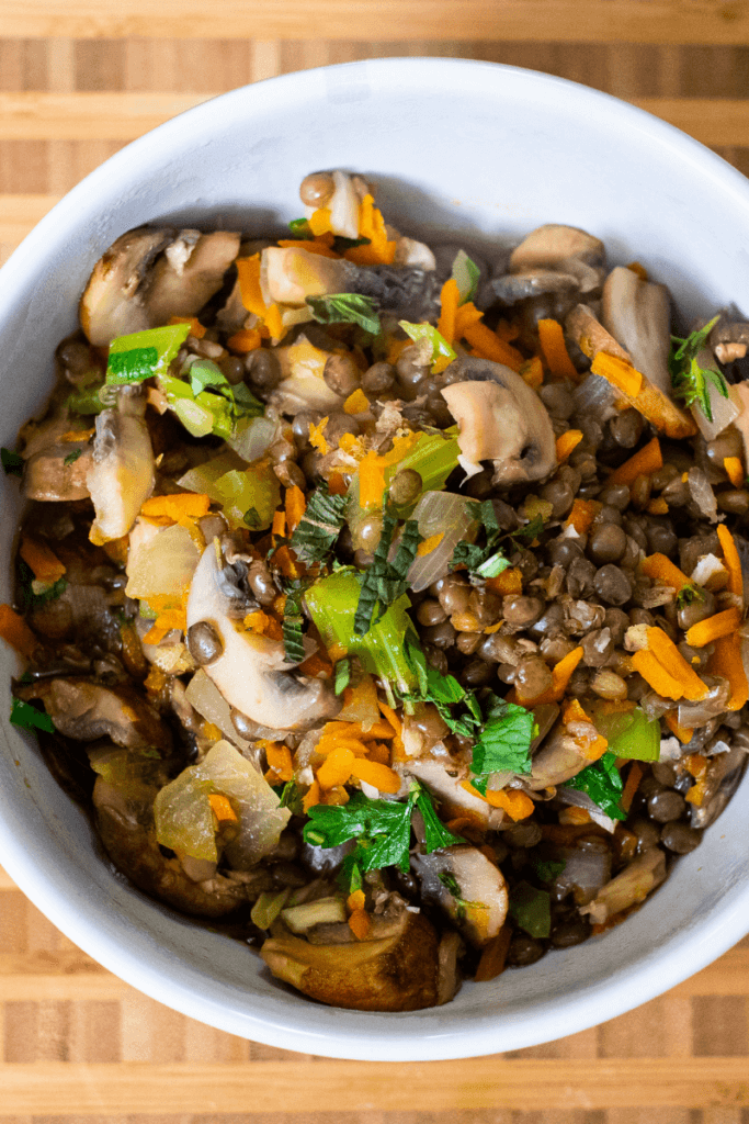 top shot of mushroom lentil show in a white bowl