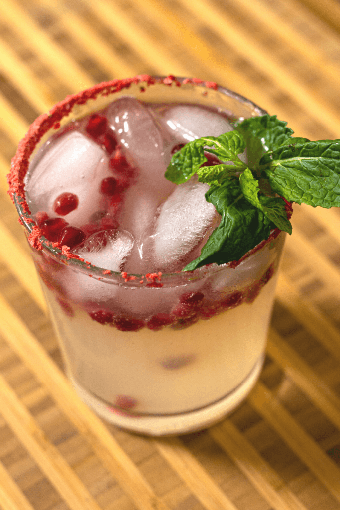 mistletoe mule garnished with mint in a low ball glass