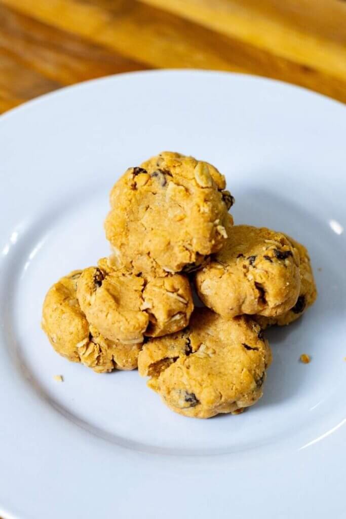 4 ingredient peanut butter oatmeal cookies on a white plate
