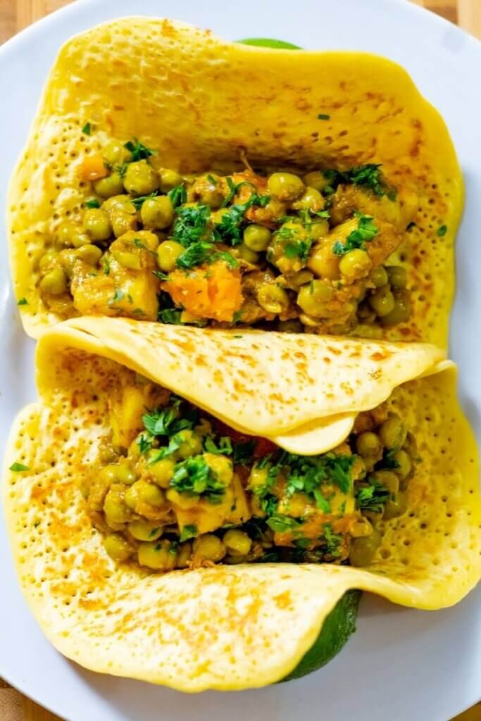 top shot of chickpea tortillas filled with vegetables