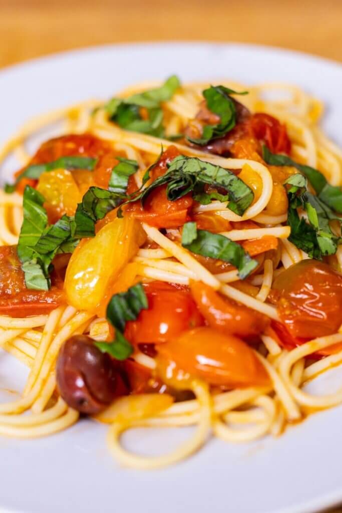 harissa pasta topped with basil