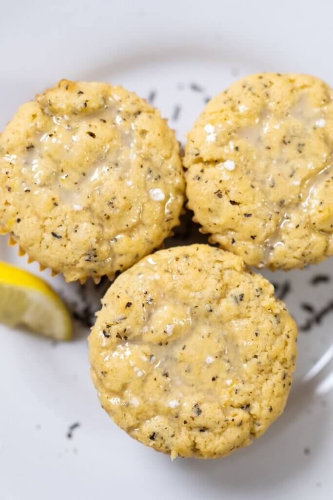 Top view of three Earl Grey cupcakes with a lemon glaze.