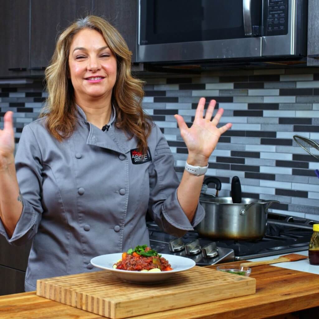 Abbie in the kitchen making Gnocchi Al Ragu.