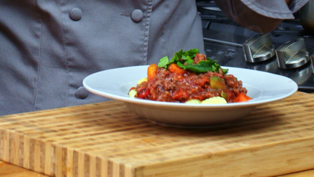 Gnocchi Al Ragu in a large white bowl.